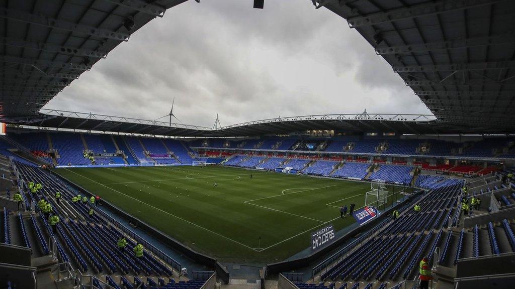 Reading FC's Select Car Leasing Stadium under story skies.