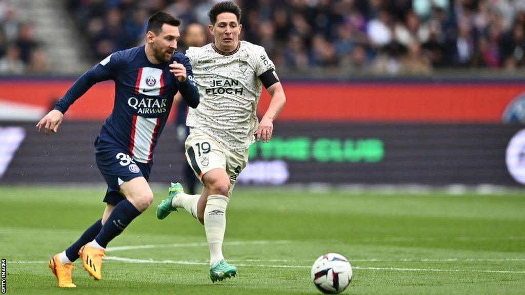 Lionel Messi of Paris Saint-Germain and Laurent Abergel