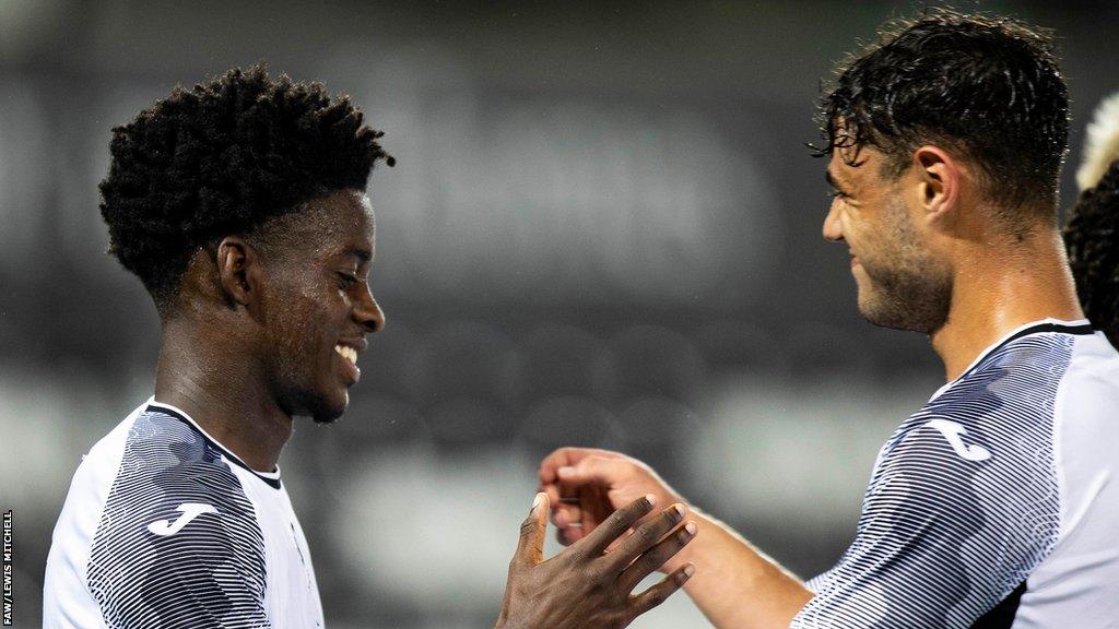 Maliq Cadogan (L) celebrates after scoring for Swansea City