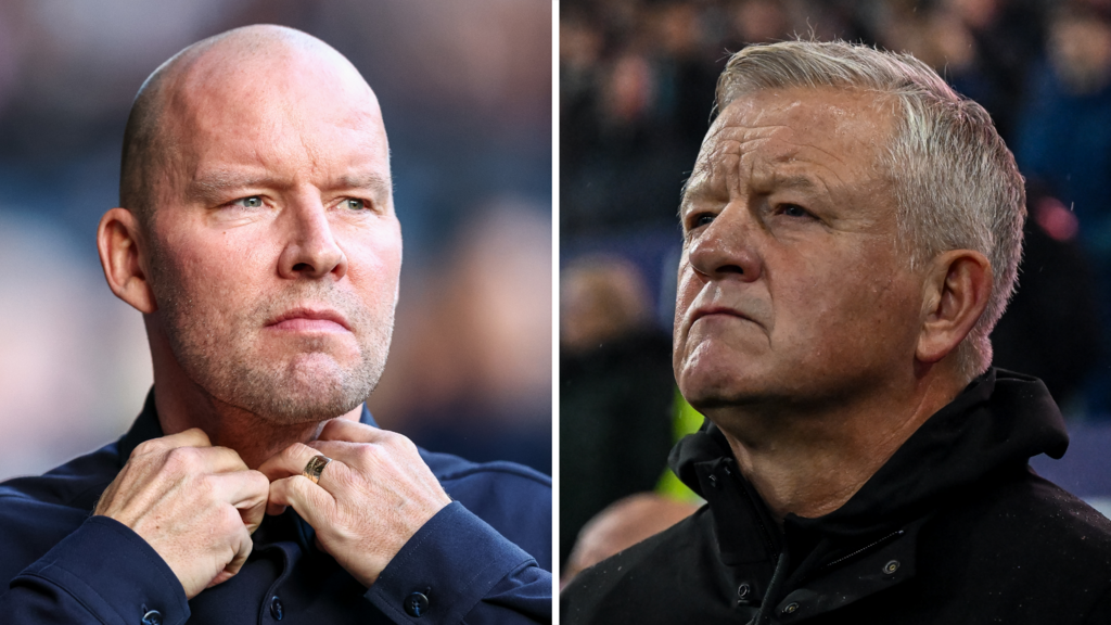 Two people looking towards the centre of the image; one adjusting their collar