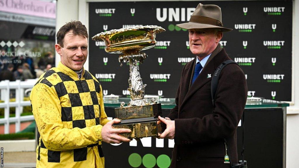 Jockey Paul Townend and trainer Willie Mullins celebrate with the Unibet Champion Hurdle Challenge Trophy on Tuesday