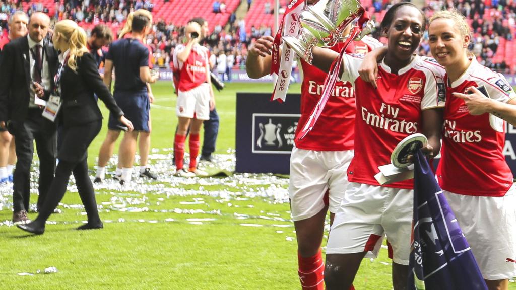 Arsenal's Dan Carter and Jordan Nobbs with the Women's FA Cup trophy