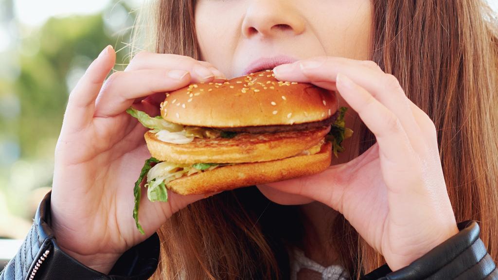 Person eating a burger