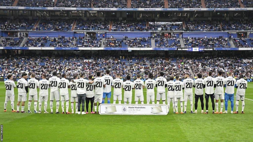 Real Madrid players wear shirts saying 'Vini Jr 20' ahead of their La Liga game against Rayo Vallecano