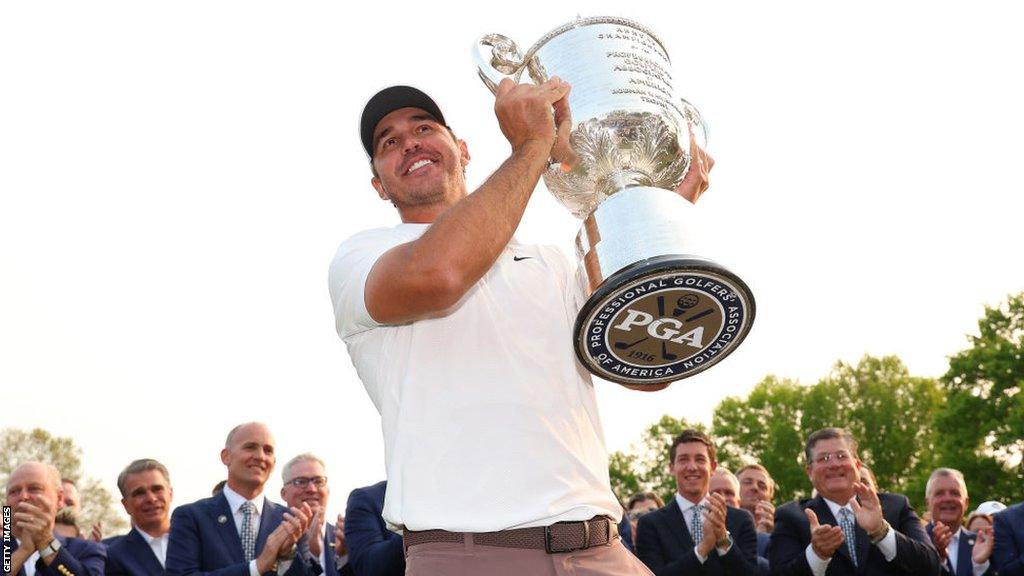 Brooks Koepka with the PGA Championship trophy following his win in May