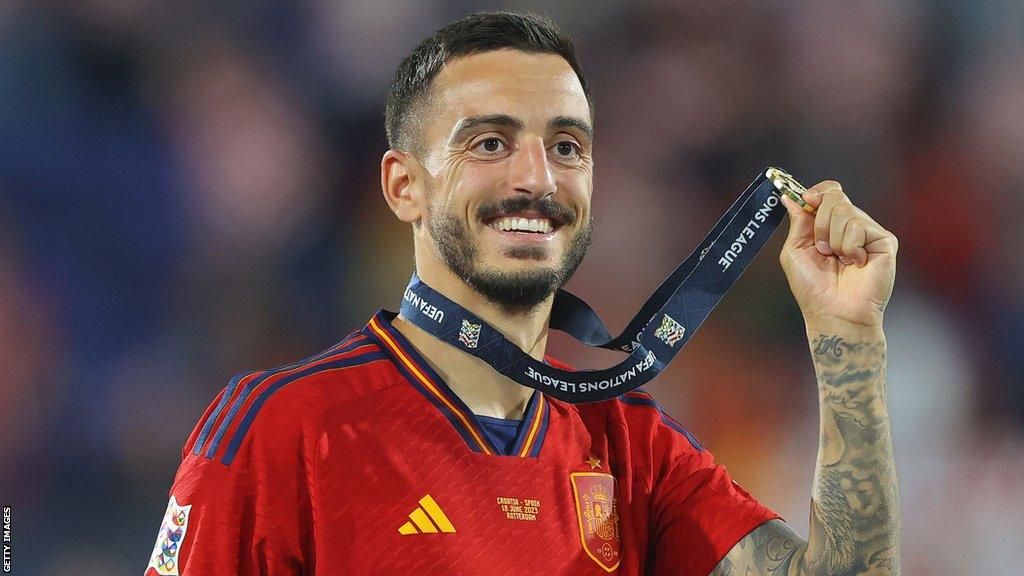 Joselu poses with his medal after winning the Nations League