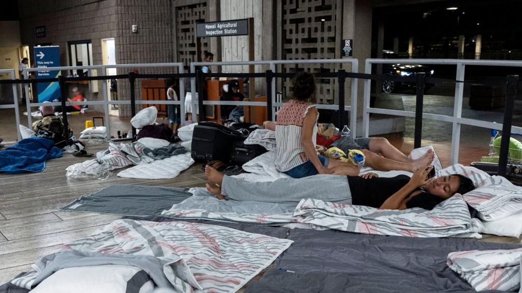 People spending the night on the floor of Kahului airport