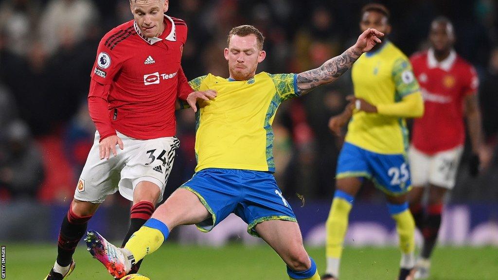 Nottingham Forest's Lewis O'Brien tackles Manchester United's Donny van de Beek in the Carabao Cup semi-final