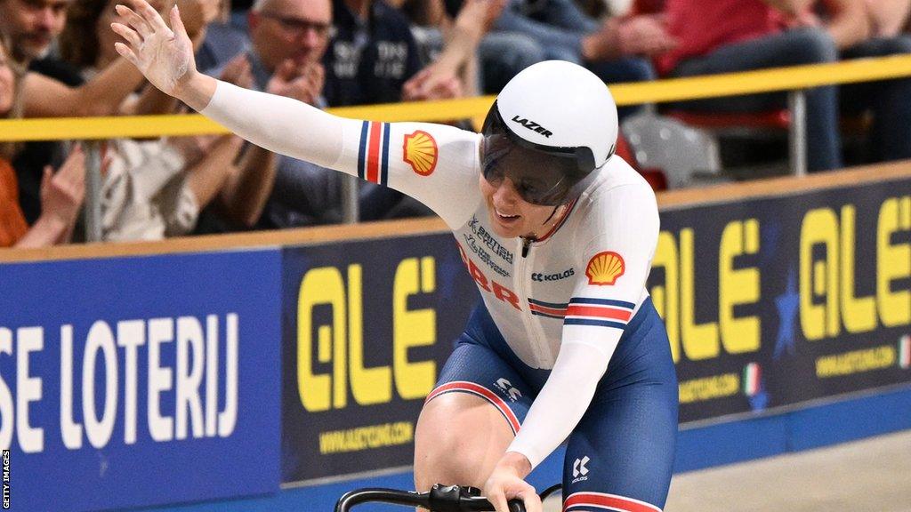 Katy Marchant celebrating on the track after winning gold