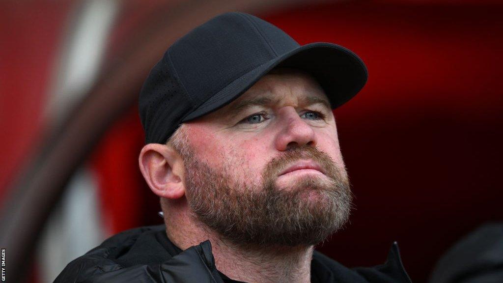 Wayne Rooney standing on the touchline when he was Birmingham City manager