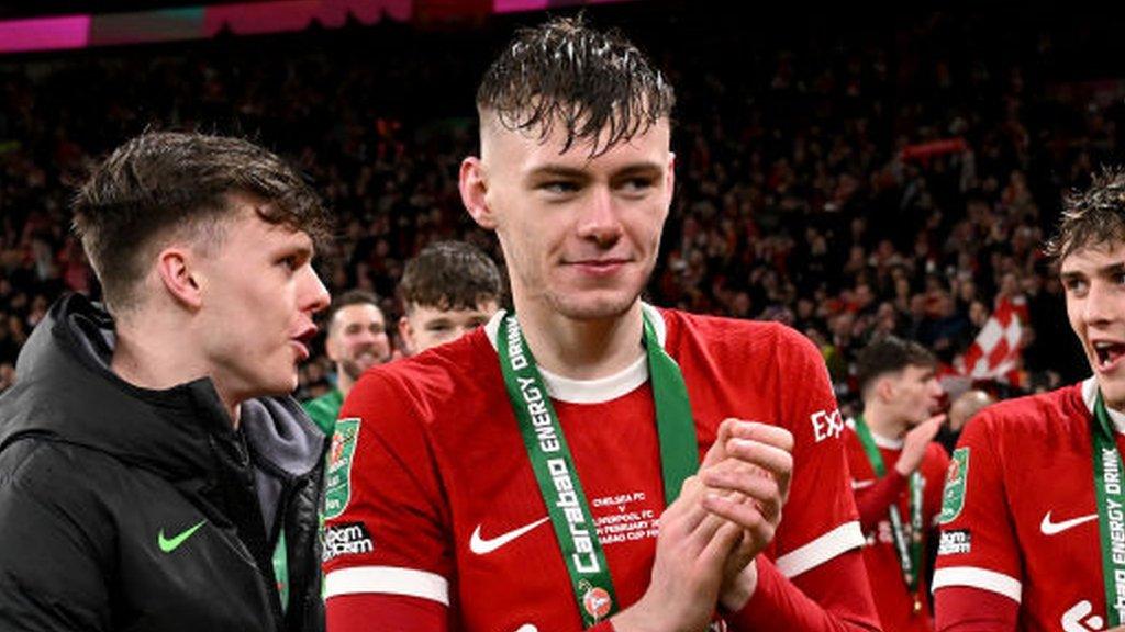 Liverpool's Conor Bradley pictured celebrating winning the league Cup at Wembley Stadium.