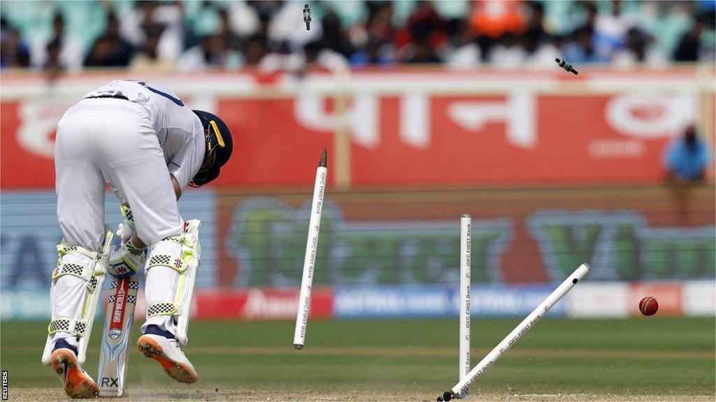 The stumps go flying as England batter Ollie Pope is bowled by Jasprit Bumrah