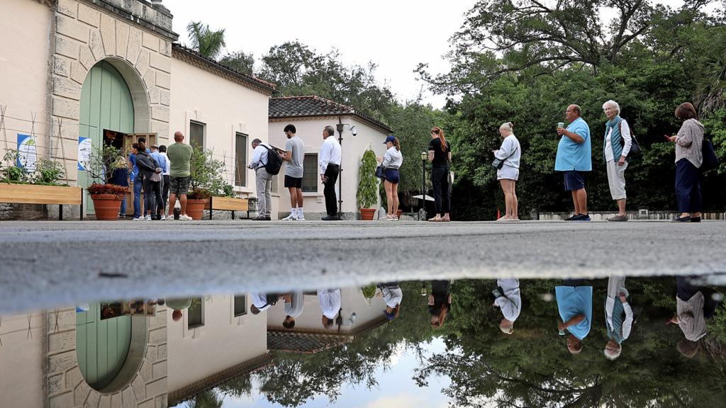 People queue outside before voting