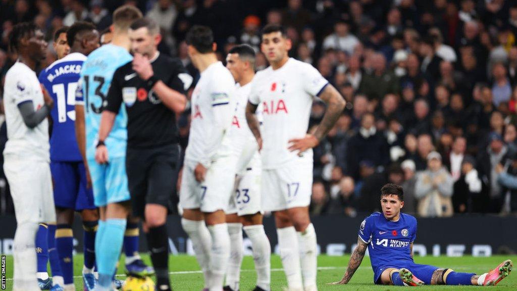 Enzo Fernandez on the floor looking at his team mates during Spurs v Chelsea