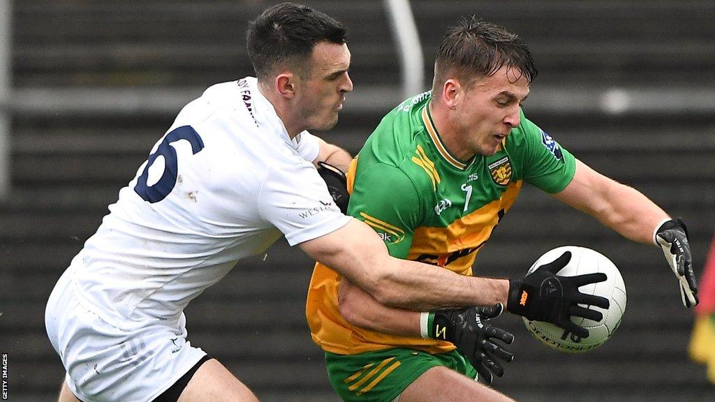 Kildare's Eoin Doyle attempts to halt Donegal's Peadar Mogan in Kildare