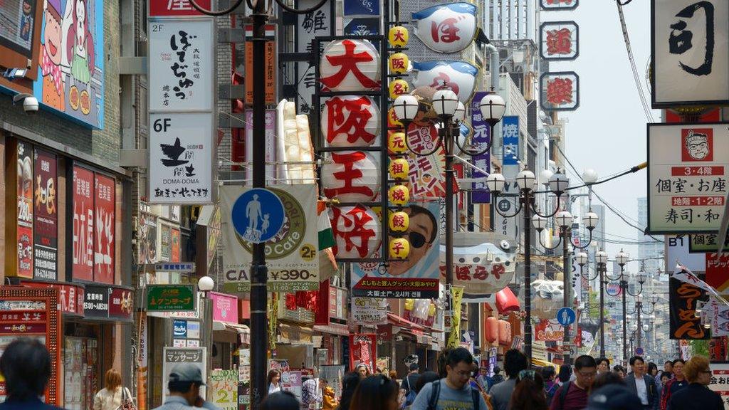 Pedestrians crowd in the main shopping street in the Dotonbori district of Osaka on March 28, 2015 in Osaka, Japan. (Photo by Frédéric Soltan/Corbis via Getty Images)