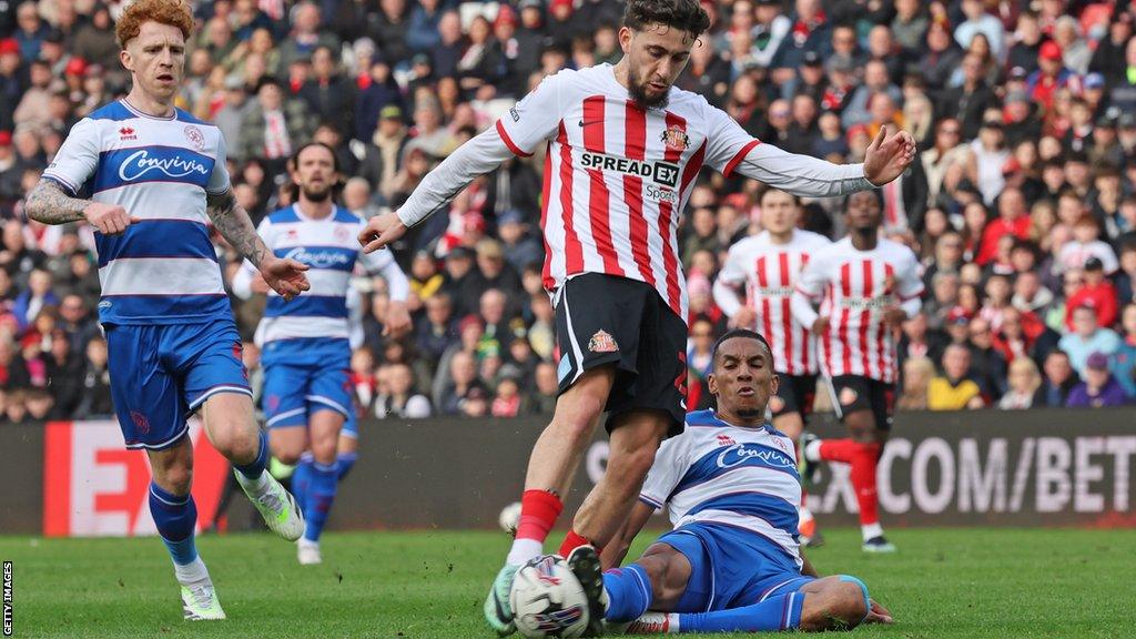 Adil Aouchiche of Sunderland is tackled as he takes a shot