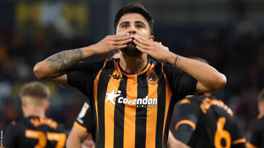 Ozan Tufan celebrates scoring Hull City's third goal against Cardiff