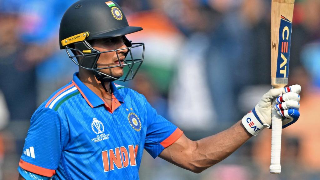 India opener Shubman Gill raises his bat after hitting fifty