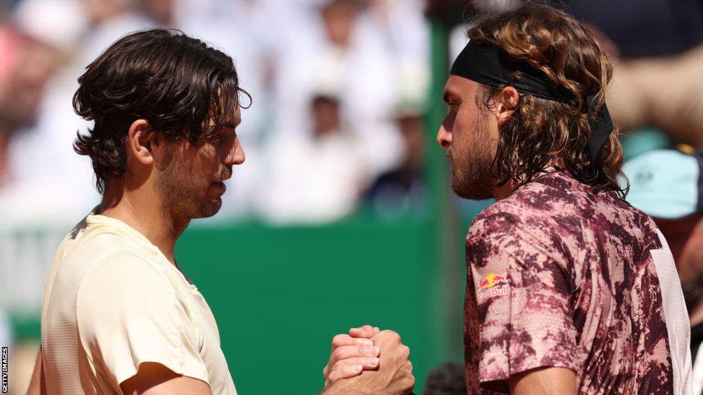 Taylor Fritz and Stefanos Tsitsipas shake hands at the net