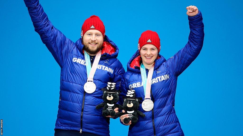 Brett Wild and Millie Knight celebrate winning Paralympic silver in 2018