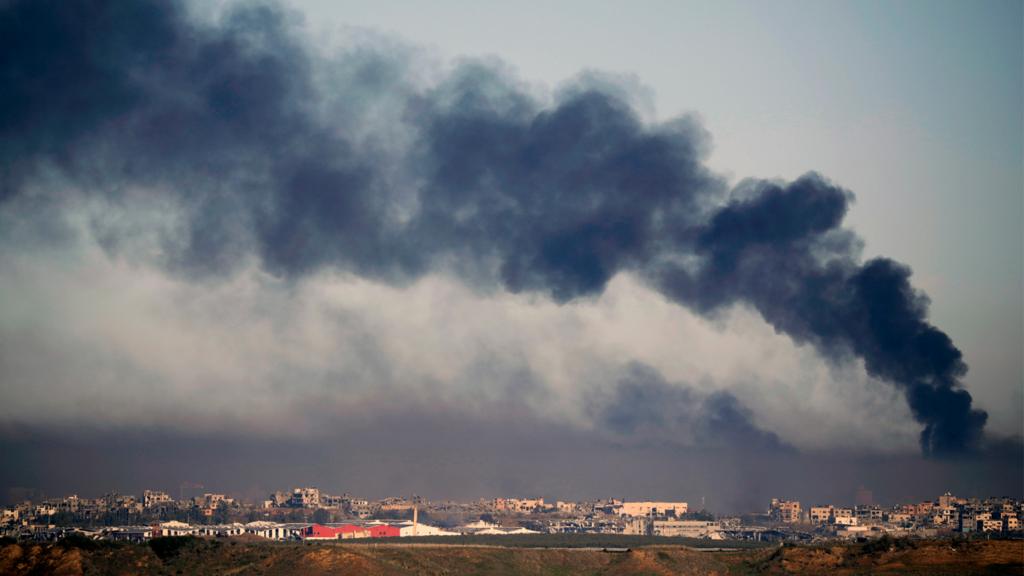 Smoke rises over northern Gaza, as viewed from the Israeli side of the border on December 15, 2023 in southern Israel.