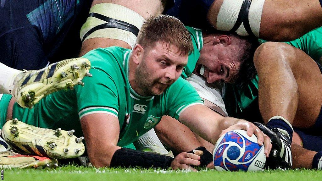 Iain Henderson scores a try against Scotland