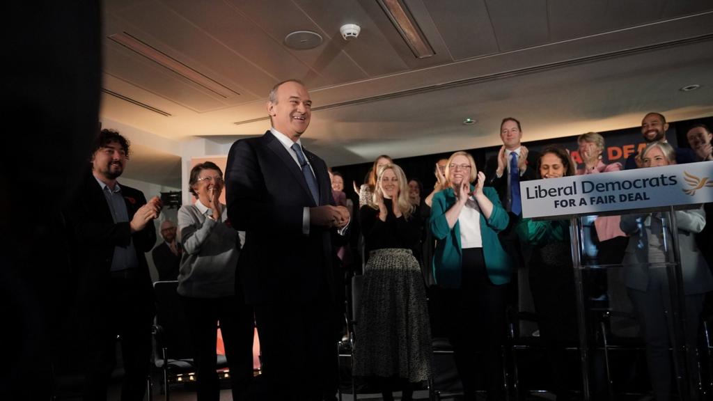 Lib Dem leader Ed Davey smiles after giving his speech to party activists