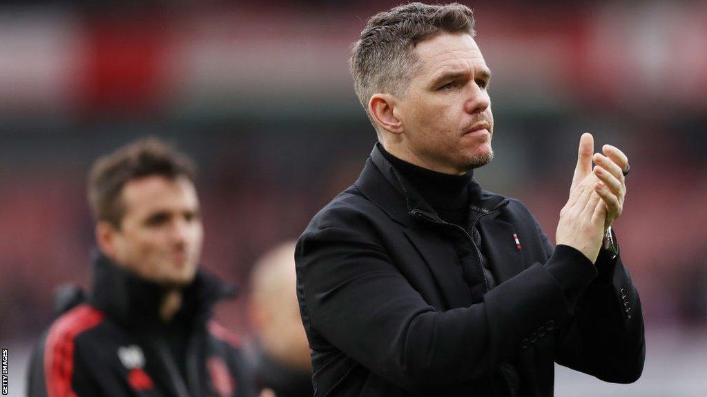 Marc Skinner reacts following Manchester United's defeat by Arsenal