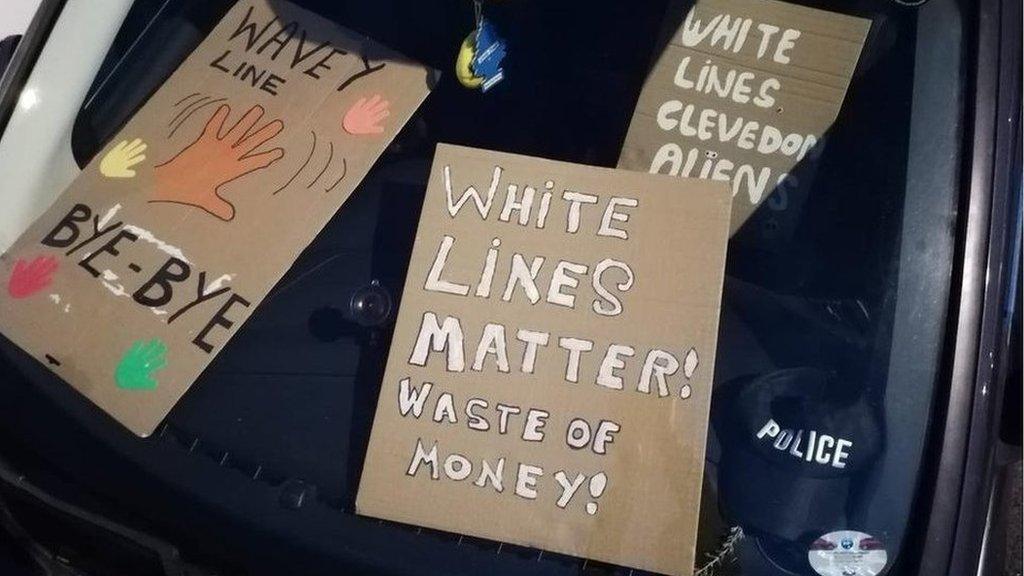 Protest banners in a car dashboard