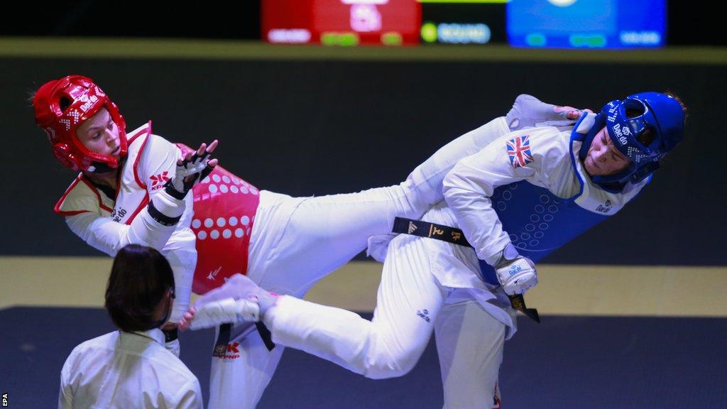 Serbian Nadica Bozanic (L) and British Rebecca McGowan fight during the semifinal of the women's -73kg category of the World Taekwondo Championship in 2022