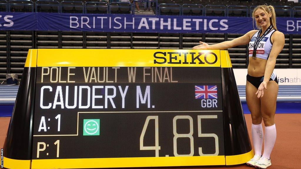 Molly Caudery smiles after jumping 4.85m