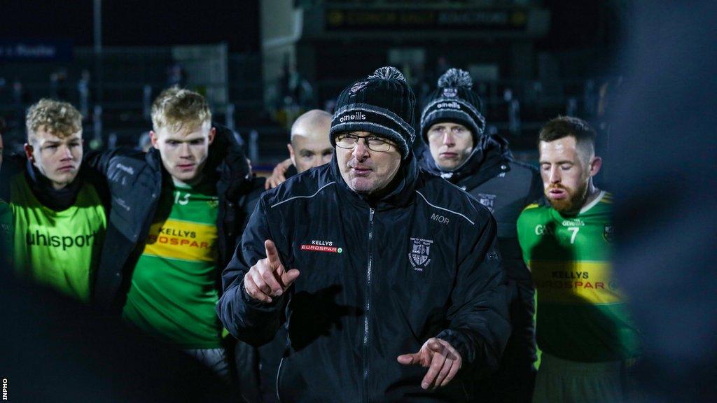 Glen manager Malachy O'Rourke speaking to his players after the Naomh Conaill game