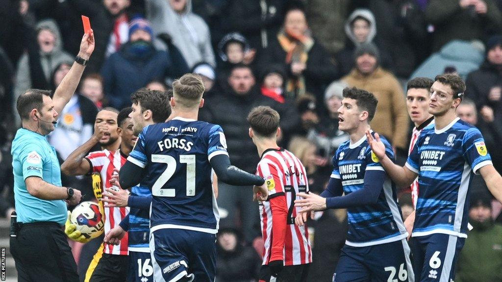 Middlesbrough's Dael Fry (right) was sent off for bringing down Ross Stewart early in the second half