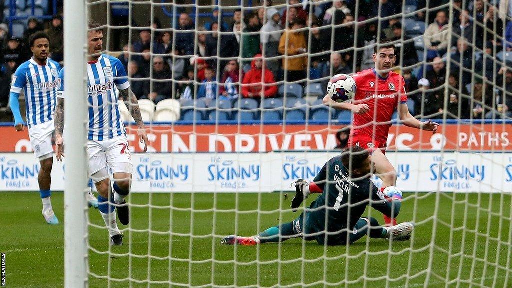 Joseph Rankin-Costello scores Blacburn's first against Huddersfield