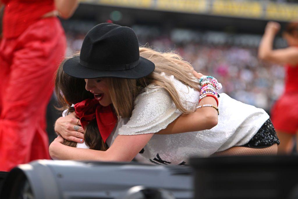 A young girl in the crowd receives the '22 hat' and a hug from Taylor Swift Dublin