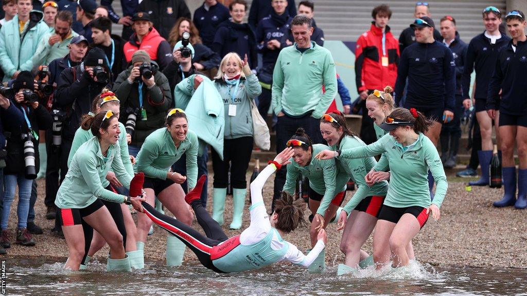 Jasper Parish is thrown into the river after Cambridge women win the 2022 Boat Race