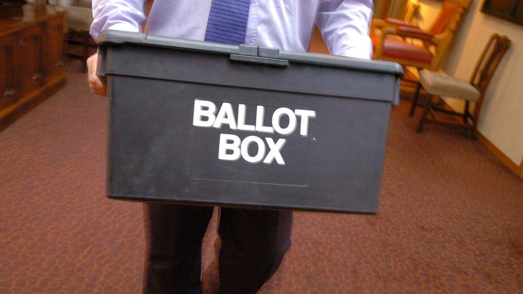 Man carrying ballot box