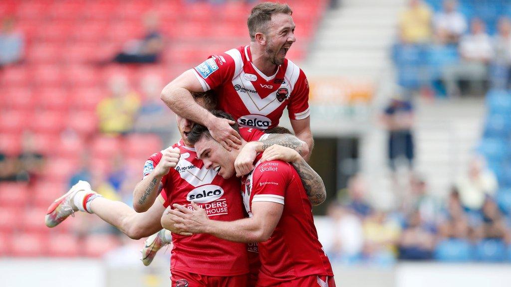 Salford Red Devils' Brodie Croft celebrates scoring their third try