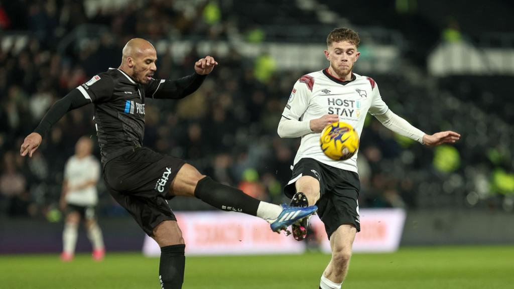 Burton Albion's Jake Caprice (left) challenges Derby County's Max Bird