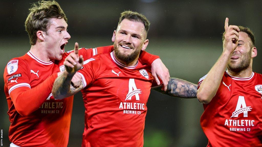 Barnsley players celebrate a goal