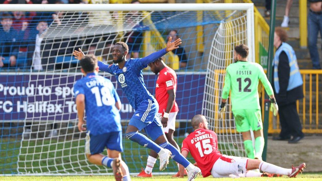 Mani Dieseruvwe of FC Halifax Town celebrates after scoring a goal to make it 3-1 against Wrexham AFC