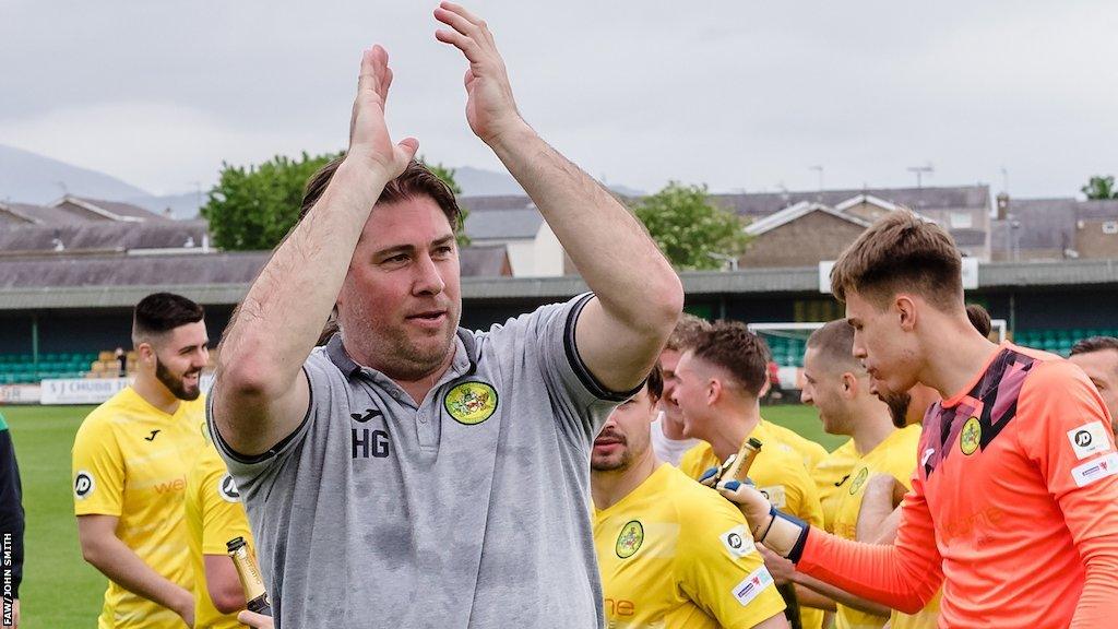 Huw Griffiths applauds Caernarfon's supporters