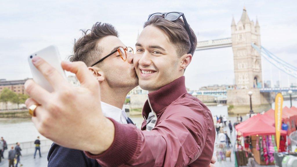 A stock photo of a couple using a phone