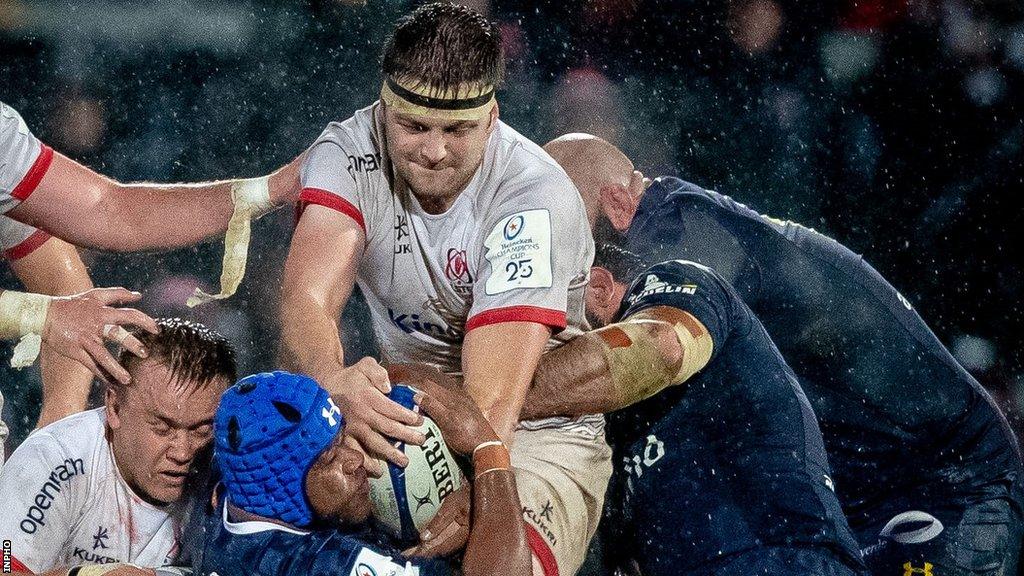 Iain Henderson wrestles for the ball with Clermont Auvergne's Apisai Naqalevu during Ulster's win in November 2019