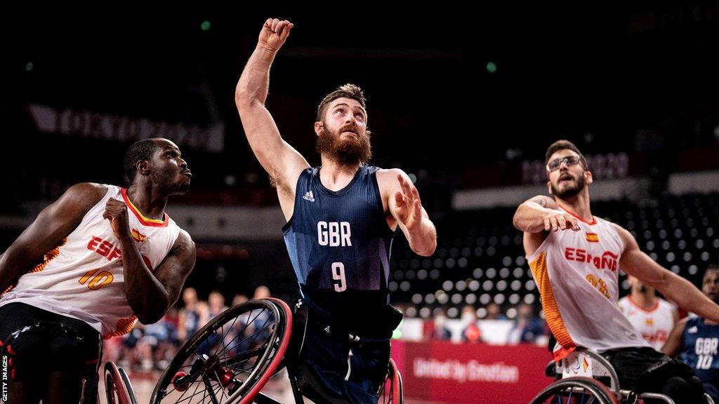 Harry Brown goes for the basket against Spain