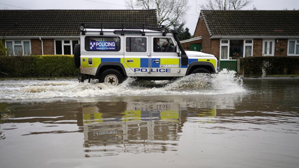 Police vehicle in flood