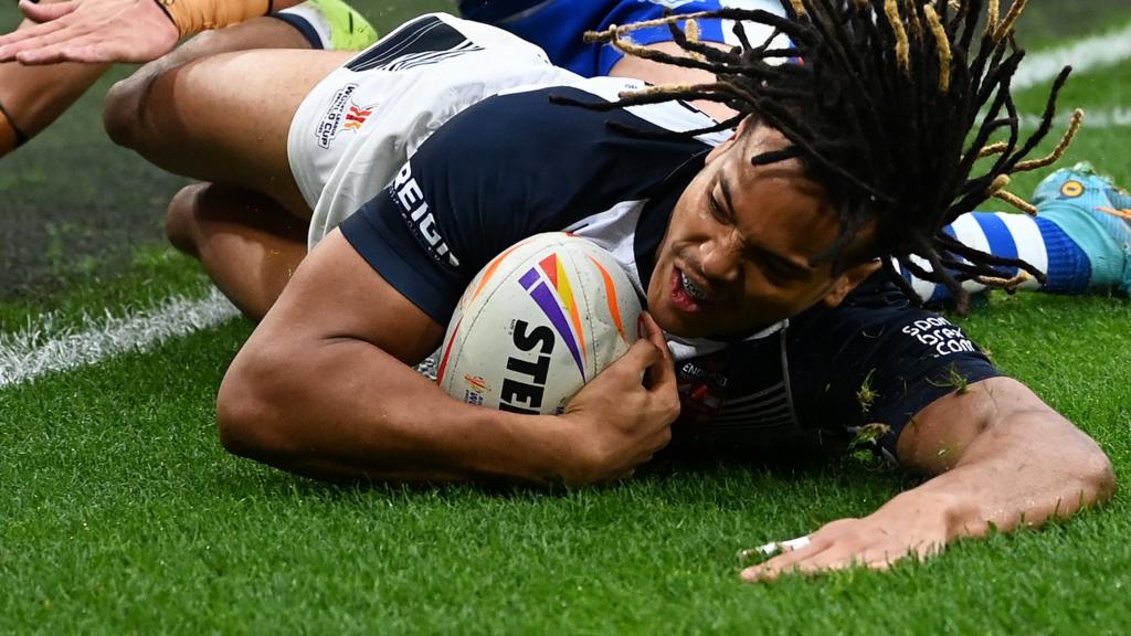 Dom Young scores a try for England against Greece