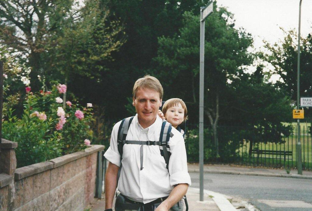 Mike carrying Caitlin in a backpack when she was a baby