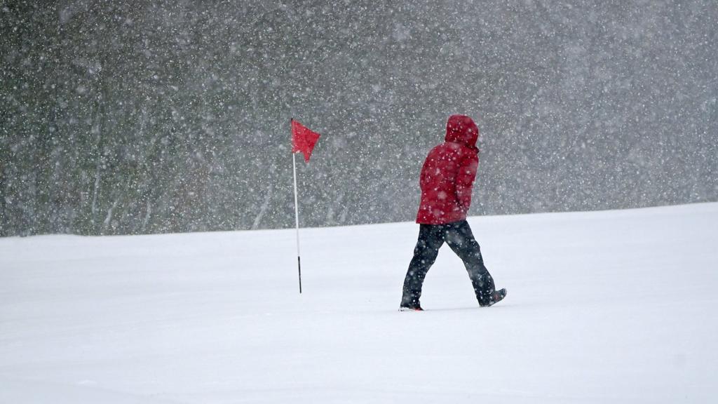 Snow falls at the Saddleworth Moor golf course in Uppermill near Oldham